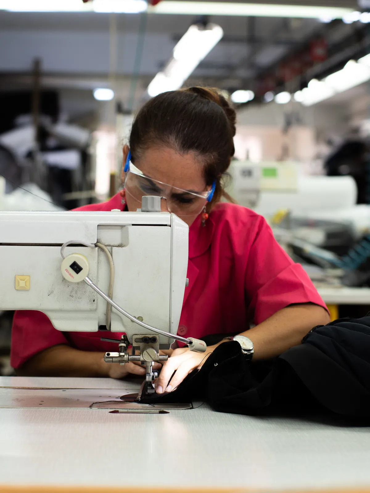 Technicians preparing denim panels on the production line